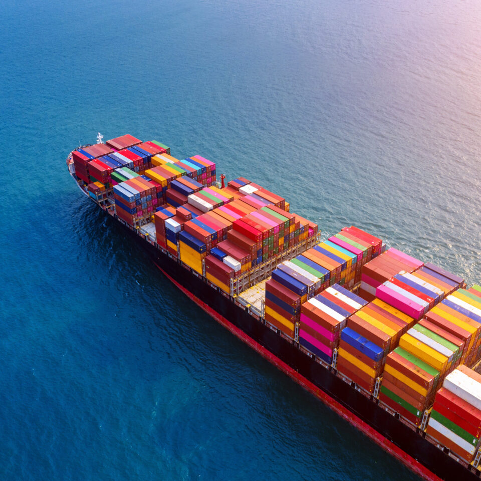 Aerial view of container cargo ship in sea.